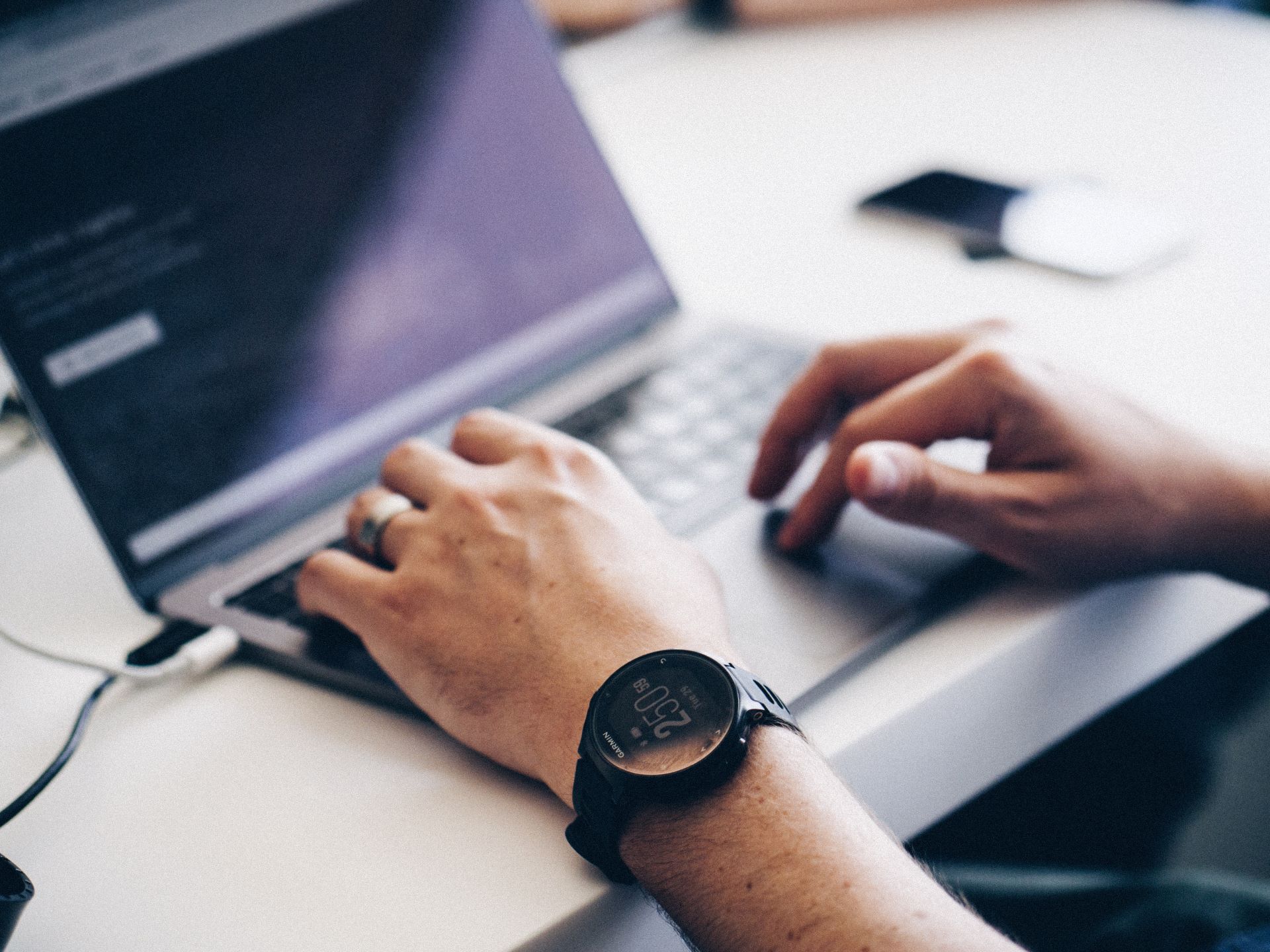 Illustration of someone typing, representing writing a bug bounty report